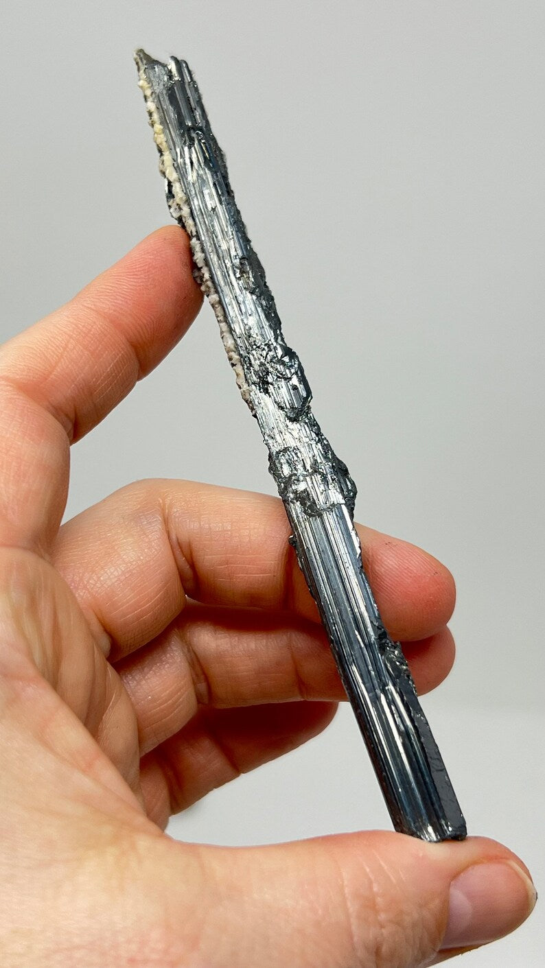 Prismatic Stibnite Blade with Calcite