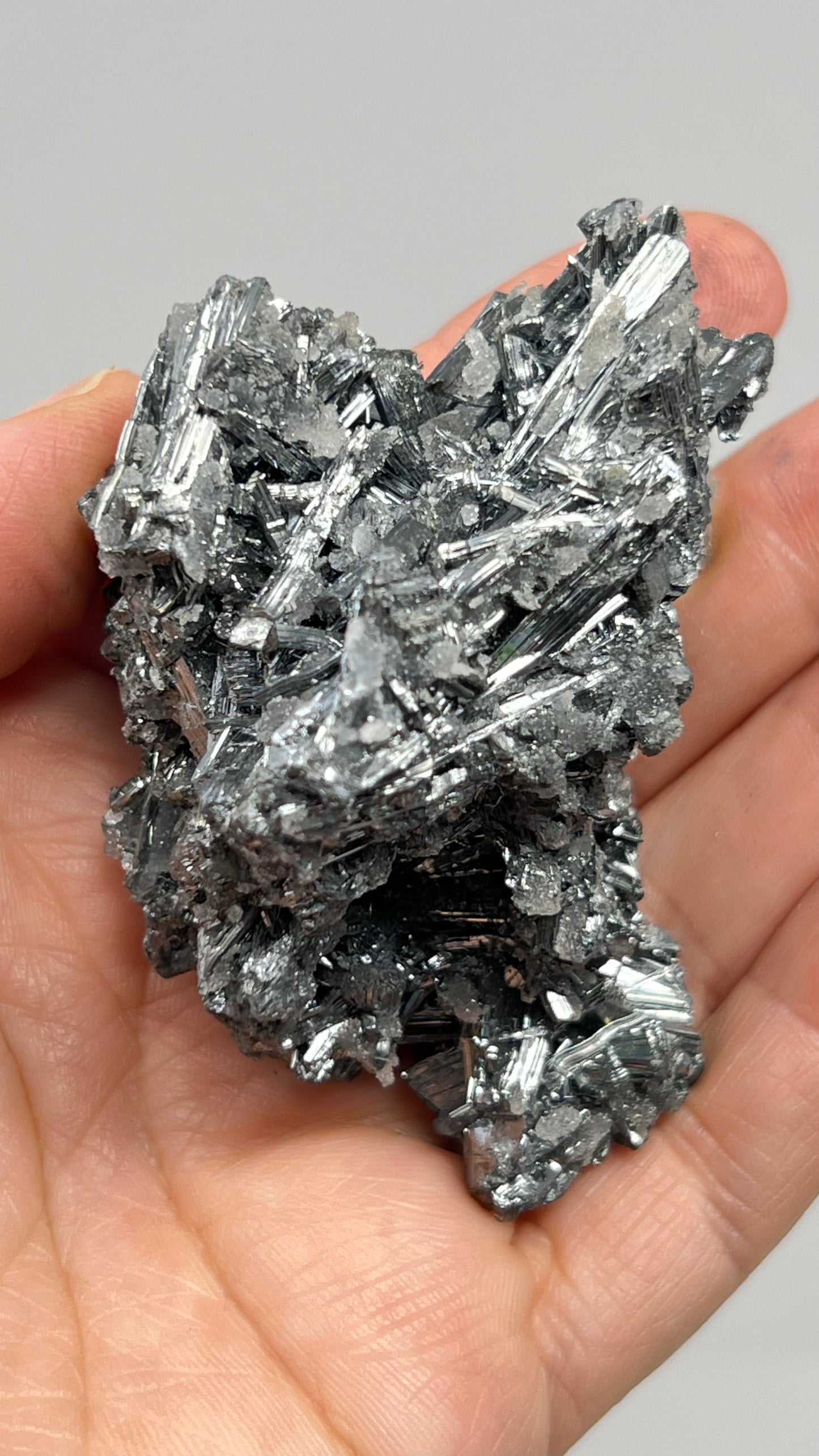 Prismatic Stibnite Cluster with Chalcedony Druse