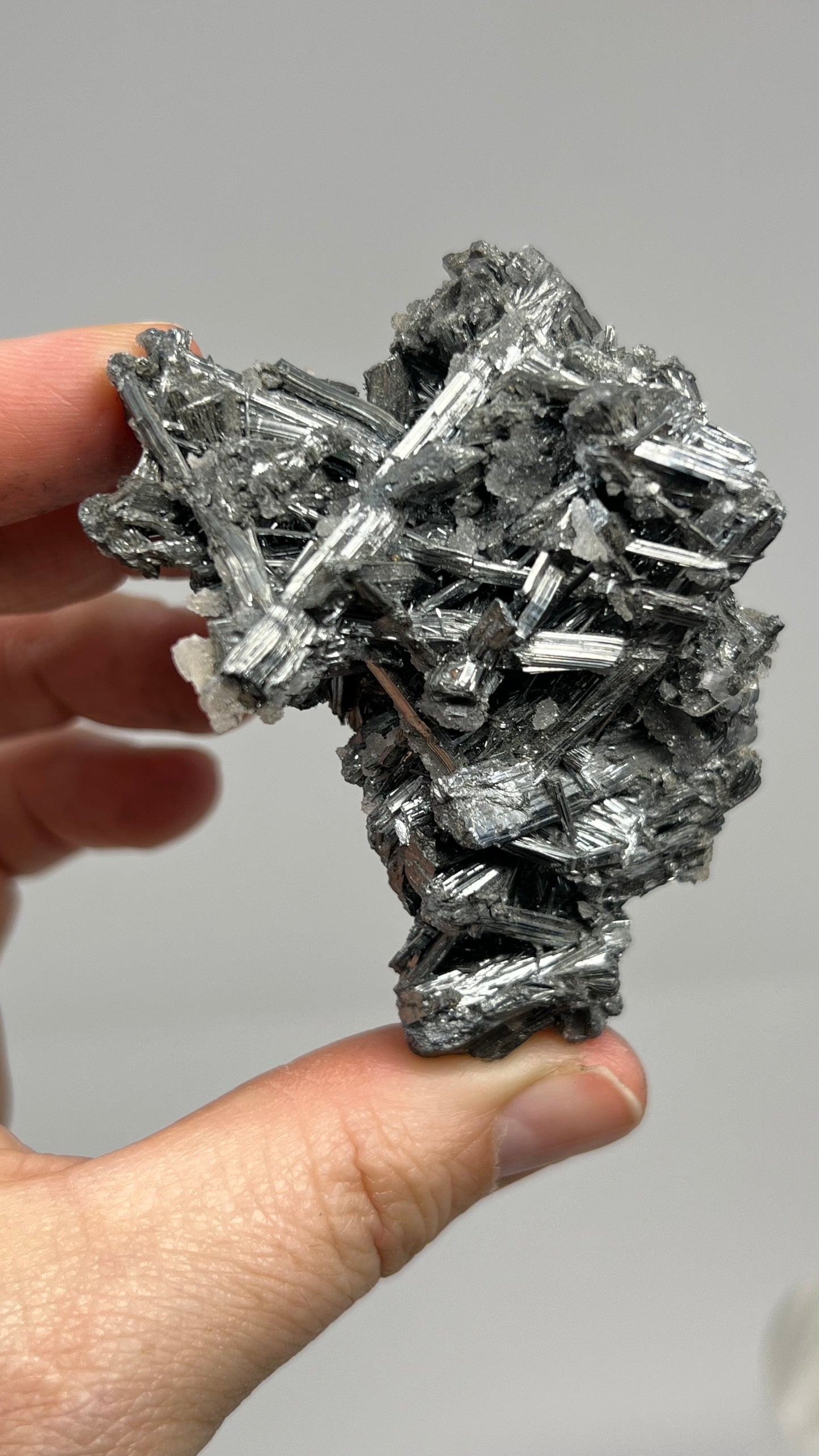 Prismatic Stibnite Cluster with Chalcedony Druse